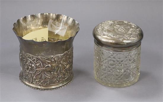 A late Victorian repousse silver cache pot by William Comyns, London, 1891 and silver mounted toilet jar.